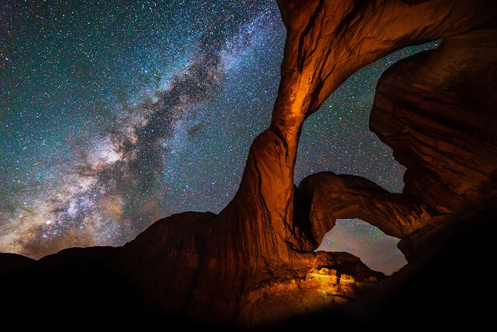 Starry night with view of the Milky Way in a red rock canyon setting