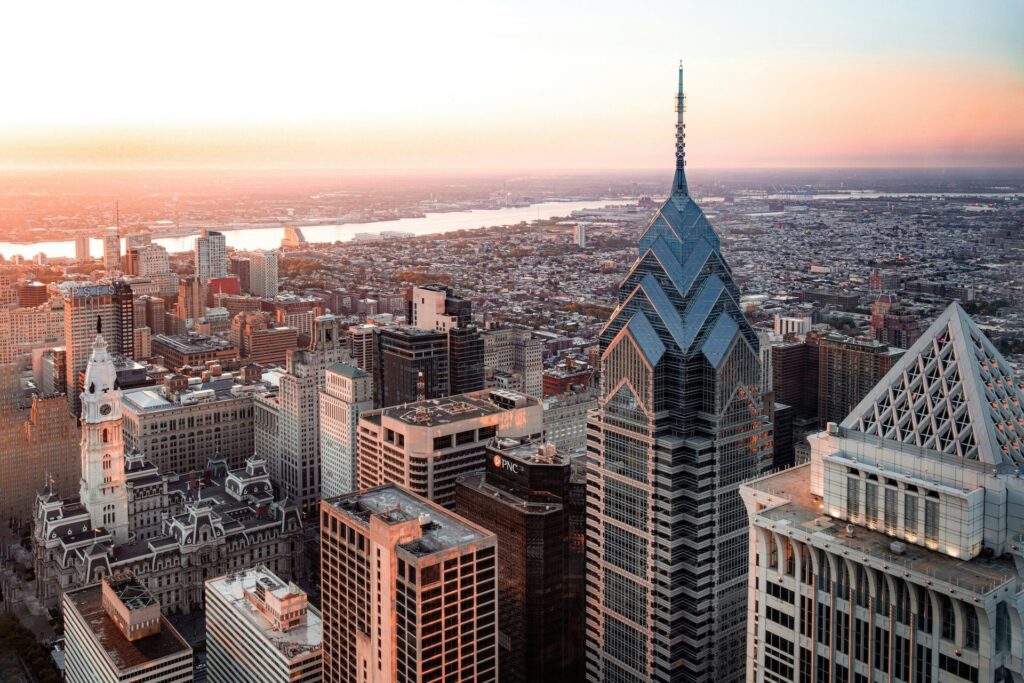 Aerial view of the Philadelphia skyline at sunset with the river in the distance